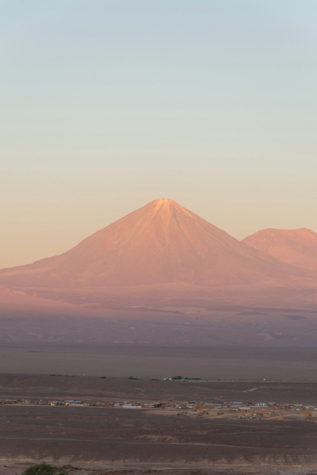 Vast red desert landscape of the Atacama Desert at dusk